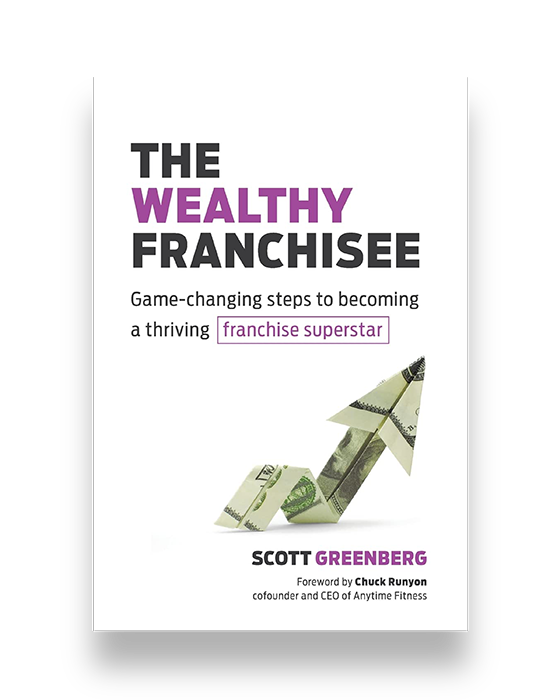 book cover of The Wealthy Franchisee with a dollar bill folded as an arrow pointing up and to the right.