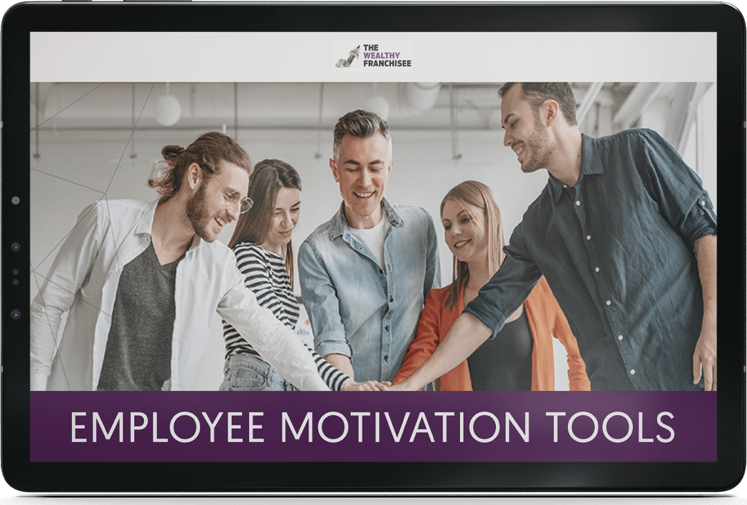 a tablet with a group of young men and women in a huddle with their hands stacked displaying the title employee motivation tools