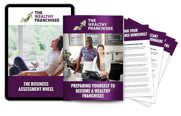 a table, brochure and worksheets displaying module 1 content, preparing yourself to become a wealthy franchisee